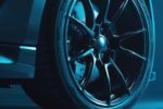 High-performance black truck rims against a bold electric blue backdrop with subtle shadows