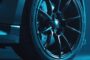 High-performance black truck rims against a bold electric blue backdrop with subtle shadows