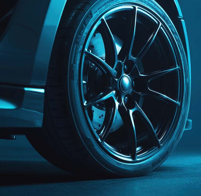 High-performance black truck rims against a bold electric blue backdrop with subtle shadows
