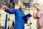 auto mechanic speaking to concerned customer